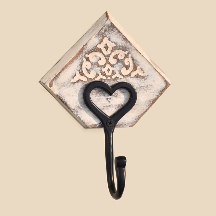 CLASSIC CAST IRON BLACK WALL HOOK WITH WHITE FLORAL PATTERN ON ENGRAVED WOOD