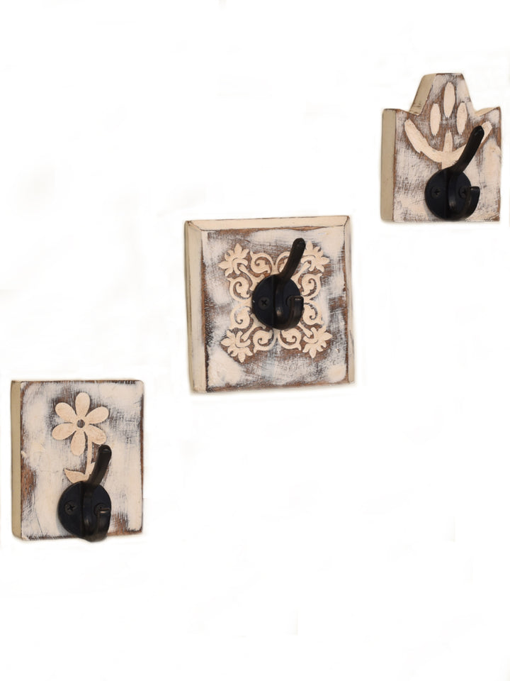 STYLISH CAST IRON BLACK WALL HOOK WITH WHITE FLORAL PATTERN ON ENGRAVED WOOD